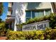 Close-up of the Harbour Hill building sign, enhancing curb appeal at 700 Beach Ne Dr # 401, St Petersburg, FL 33701
