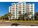 Modern, multi-story Harbour Hill building with balconies and palm trees at 700 Beach Ne Dr # 401, St Petersburg, FL 33701