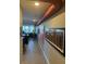 Bright hallway with artwork leading to the kitchen at 700 Beach Ne Dr # 401, St Petersburg, FL 33701