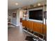 Mid-century modern living room with built-in shelving and TV at 700 Beach Ne Dr # 401, St Petersburg, FL 33701
