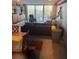 Spacious living room with sectional sofa and balcony access at 700 Beach Ne Dr # 401, St Petersburg, FL 33701