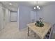 Elegant dining area with a light-colored table and chairs at 7134 Merlot Sienna Ave, Gibsonton, FL 33534