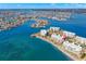 Stunning aerial view of the condo building, showcasing its prime location and waterfront access at 8020 Sailboat Key S Blvd # 401, St Pete Beach, FL 33707