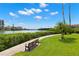 A bench along the waterfront path for enjoying the water view at 8020 Sailboat Key S Blvd # 401, St Pete Beach, FL 33707