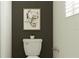 Simple bathroom with toilet and dark accent wall at 9760 Minnow Ray Dr, Land O Lakes, FL 34638