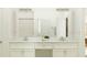 Double vanity bathroom with modern white cabinets at 9760 Minnow Ray Dr, Land O Lakes, FL 34638
