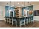 Modern community bar with a hexagon-tiled countertop and pendant lighting at 9760 Minnow Ray Dr, Land O Lakes, FL 34638