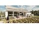 Outdoor kitchen area with seating and gardens at 9760 Minnow Ray Dr, Land O Lakes, FL 34638