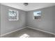 Bedroom with tile flooring and two windows at 10515 118Th Ave, Largo, FL 33773