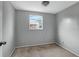 Simple bedroom with wood floors and window at 10515 118Th Ave, Largo, FL 33773