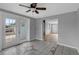 Dining room with tile floor, ceiling fan, and French doors to backyard at 10515 118Th Ave, Largo, FL 33773