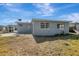 House exterior showcasing backyard and blue sky at 10515 118Th Ave, Largo, FL 33773