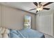 Bedroom with neutral walls, carpet, fan, window with blinds, and closet at 11210 Kelly Green Ave, Wimauma, FL 33598