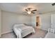 Bedroom with ceiling fan and neutral walls and carpet at 11210 Kelly Green Ave, Wimauma, FL 33598