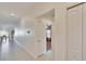 Hallway with tile floor and access to living area and bedrooms at 11210 Kelly Green Ave, Wimauma, FL 33598