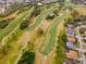 Scenic aerial view of the golf course community, with residential homes lining the fairway at 13001 Prestwick Dr, Riverview, FL 33579