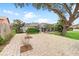 Paver driveway and mature landscaping highlight this home's backyard at 13001 Prestwick Dr, Riverview, FL 33579