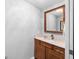 This bathroom features a granite vanity and framed mirror at 13001 Prestwick Dr, Riverview, FL 33579