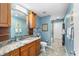 Blue bathroom with tiled walk-in shower, vanity and tile floors at 13001 Prestwick Dr, Riverview, FL 33579