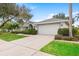 Beautiful single-story home with a two-car garage and manicured landscaping at 13001 Prestwick Dr, Riverview, FL 33579