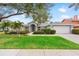 Charming single-story home with a well-maintained lawn and landscaped garden at 13001 Prestwick Dr, Riverview, FL 33579