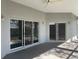 Covered patio with sliding glass doors and ceiling fan at 13184 73Rd Ave, Seminole, FL 33776