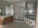 Bathroom with soaking tub, shower, and double vanity at 13184 73Rd Ave, Seminole, FL 33776