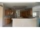 Large kitchen with an island, ample cabinetry, and white countertops at 13184 73Rd Ave, Seminole, FL 33776