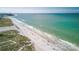 Beachfront property, aerial view shows beach and ocean at 13405 Gulf Blvd, Madeira Beach, FL 33708