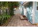 Side patio with walkway and access to the house at 13405 Gulf Blvd, Madeira Beach, FL 33708