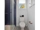 Small bathroom with navy blue shower and patterned floor at 1501 N Morgan St # 7, Tampa, FL 33602