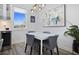 Modern dining area with white table and gray chairs at 1501 N Morgan St # 7, Tampa, FL 33602