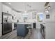 Modern kitchen with an island, white cabinets, and stainless steel appliances at 1501 N Morgan St # 7, Tampa, FL 33602