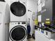 Stackable washer and dryer in a well-lit laundry room at 1501 N Morgan St # 7, Tampa, FL 33602