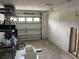 Spacious garage with storage shelving and open door at 1798 Shore Acres Ne Blvd, St Petersburg, FL 33703