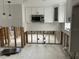 Modern kitchen featuring white cabinetry and quartz countertops at 1798 Shore Acres Ne Blvd, St Petersburg, FL 33703