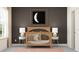 Bedroom with crib, side tables, and moon artwork at 18175 Serene Lake Loop, Lutz, FL 33548