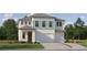 Two-story house with light blue and white siding, two-car garage, and landscaping at 18175 Serene Lake Loop, Lutz, FL 33548