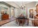 Formal dining room with hardwood floors and a charming wine storage at 19116 Sweet Clover Ln, Tampa, FL 33647