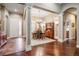 Elegant entryway with hardwood floors, a formal dining area, and ample natural light at 19116 Sweet Clover Ln, Tampa, FL 33647