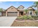 Stunning two-story home with stone exterior and landscaping at 19116 Sweet Clover Ln, Tampa, FL 33647