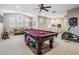 Game room featuring a pool table, exercise equipment, and ample space at 19116 Sweet Clover Ln, Tampa, FL 33647