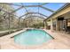 Spacious screened pool and spa with outdoor entertaining space at 19116 Sweet Clover Ln, Tampa, FL 33647