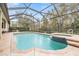 Inviting pool and spa with screened enclosure, perfect for relaxation at 19116 Sweet Clover Ln, Tampa, FL 33647