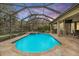 Screened-in pool and spa with a covered lanai at 19116 Sweet Clover Ln, Tampa, FL 33647