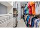 Large walk-in closet with ample shelving and hanging space at 19116 Sweet Clover Ln, Tampa, FL 33647