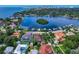 Breathtaking aerial view of a waterfront community with lush greenery and city skyline in the background at 200 Brightwaters Ne Blvd, St Petersburg, FL 33704