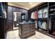 Expansive walk-in closet with custom shelving, ample storage space, and a mirrored vanity area for organization at 200 Brightwaters Ne Blvd, St Petersburg, FL 33704