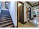 Inviting hallway featuring rich wood trim and a stunning modern art piece, leading to other rooms at 200 Brightwaters Ne Blvd, St Petersburg, FL 33704