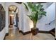 Bright hallway featuring elegant tile flooring, arched doorways, and beautiful accent lighting creating a welcoming ambiance at 200 Brightwaters Ne Blvd, St Petersburg, FL 33704